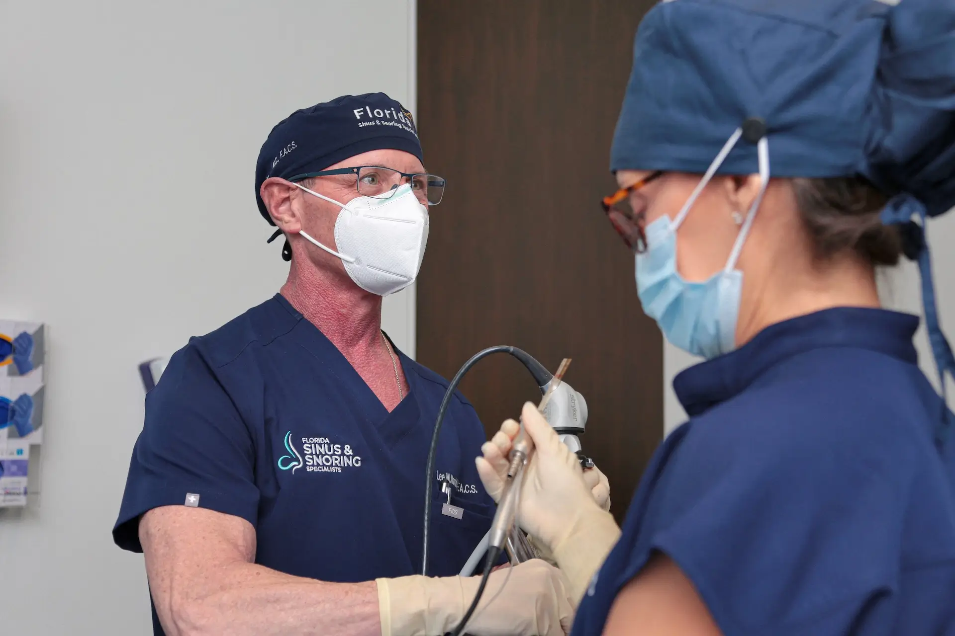 Dr. Lee Mandel consulting with a patient at the Fort Lauderdale office