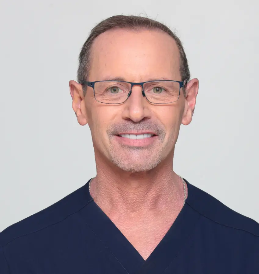 Dr. Lee M. Mandel, double board-certified otolaryngologist and facial plastic surgeon